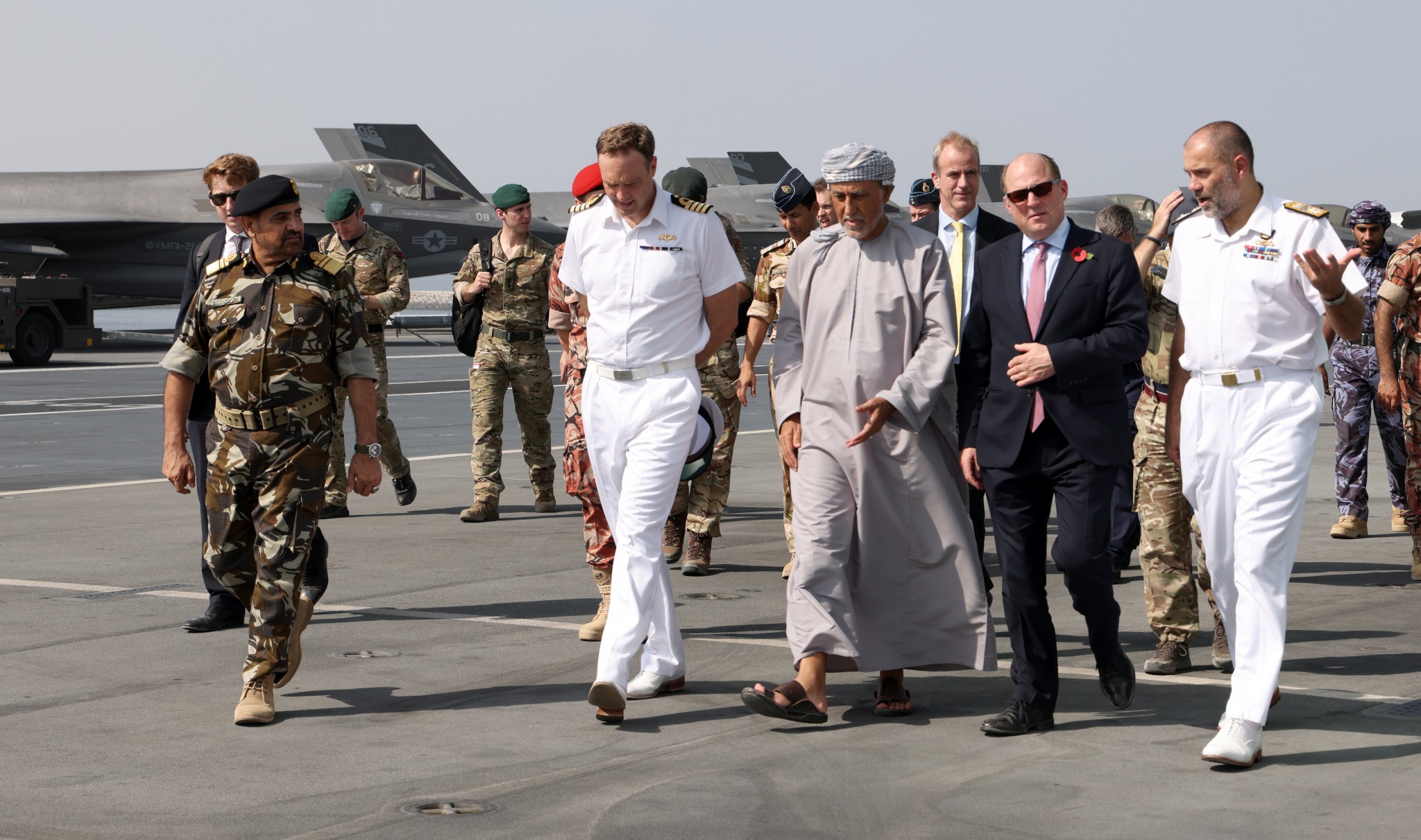 Ben Wallace (red tie) visits HMS Queen Elizabeth in Oman (Photo: Unaisi Luke / MOD)