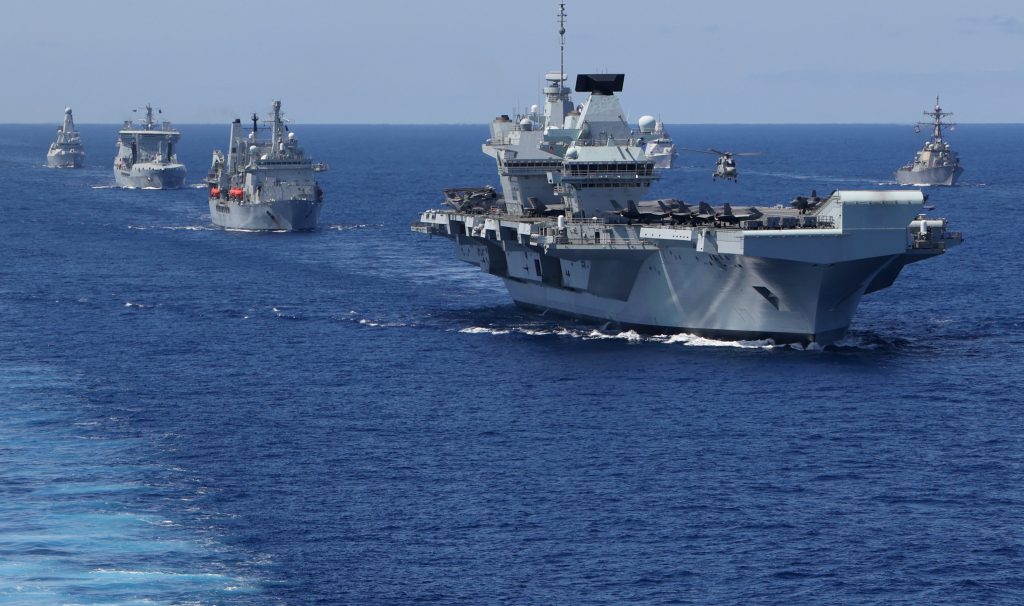 HMS Queen Elizabeth with her escort and supply ships (Photo: USMC / Unaisi Luke)