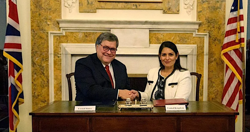 Then US Attorney General William Barr and Priti Patel sign the Cloud Act in Washington DC, 3 October 2019. (Photo: US Department of Justice)