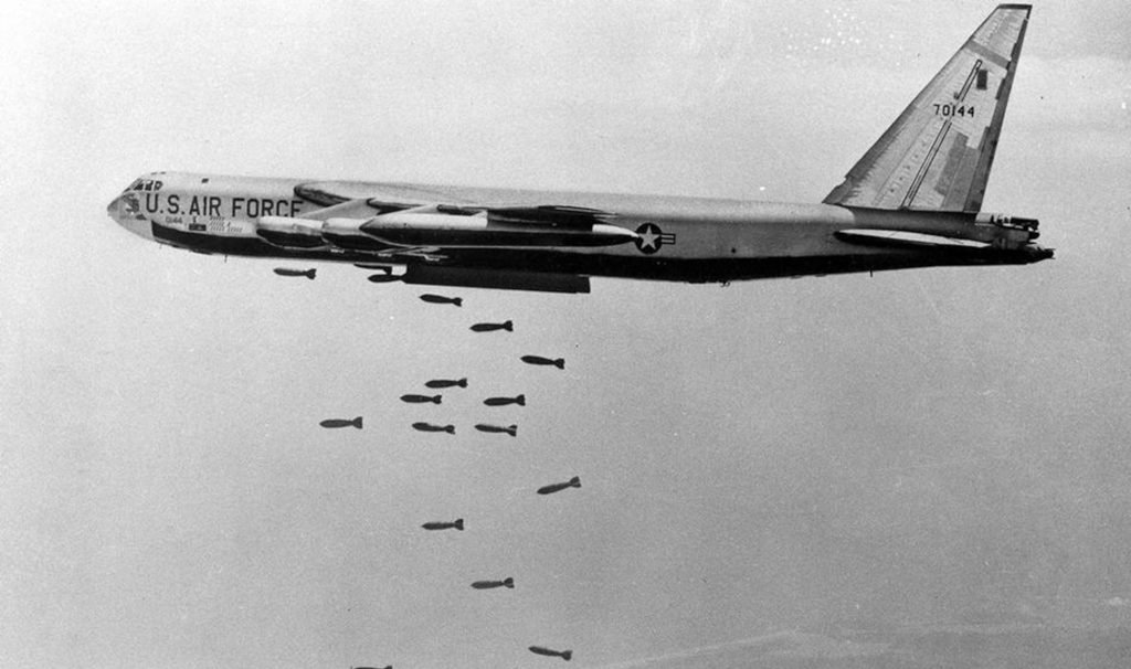A US B-52 drops a load of 750-pounds bombs over a Vietnamese coastal area, 5 November 1965. (Photo: USAF)