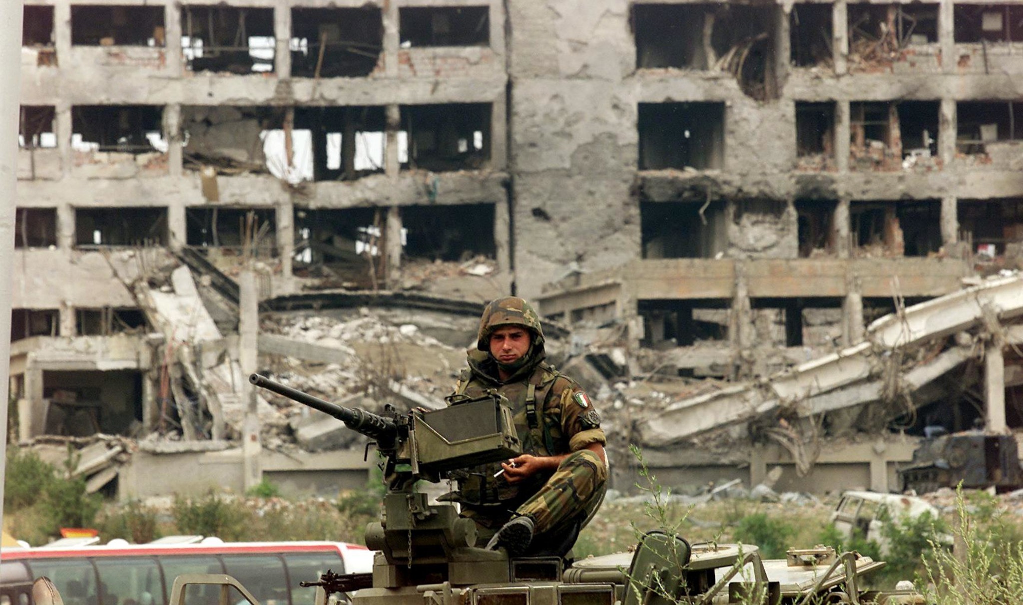 An Italian soldier at a Serb police headquarters destroyed by NATO in Djakovica, Kosovo, in 1999. (Photo: Mike Nelson / AFP via Getty)