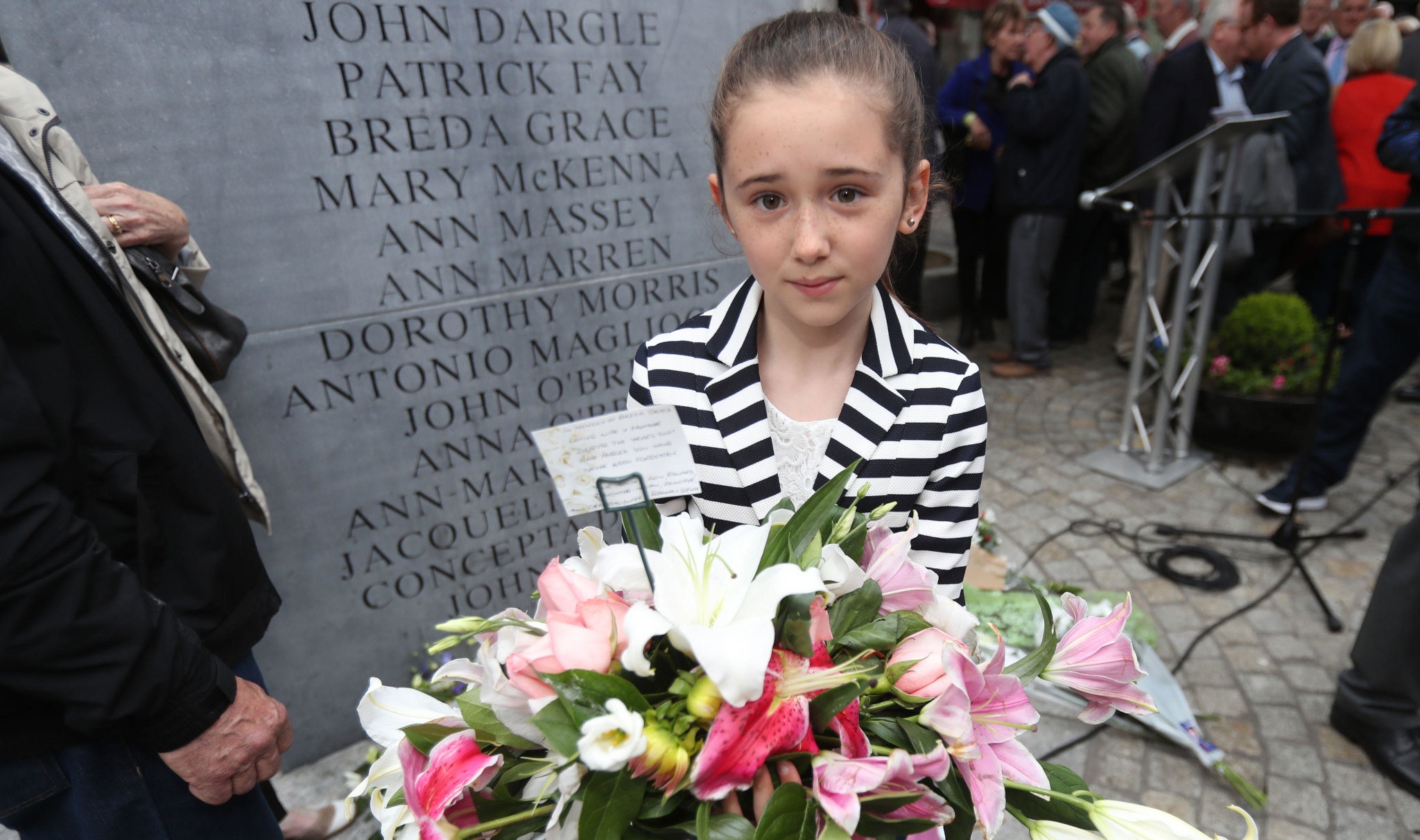 Roseanna Grace, whose grandmother Breda was killed in the attack, attends a memorial service. (Photo: Niall Carson via Alamy)